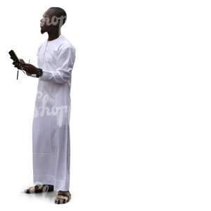 black muslim man with a smartphone standing