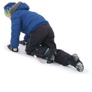 young boy playing in the snow