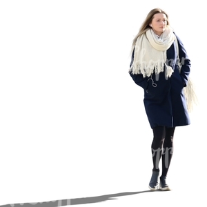 woman in a blue coat and white scarf walking