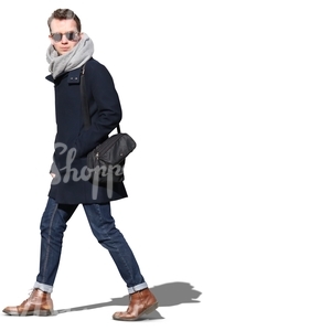 man wearing sunglasses and a black jacket walking