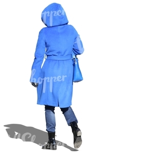 woman wearing a hooded blue coat walking on a sunny day