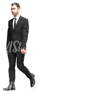 businessman in a black suit walking