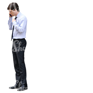 young businessman standing and talking on the phone