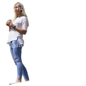 woman standing on a balcony and drinking coffee