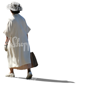 elderly lady in a white summer coat walking