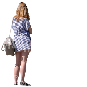 woman in a striped shirt standing seen from below