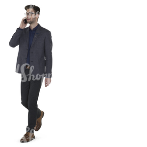 modern businessman walking and talking on the phone 