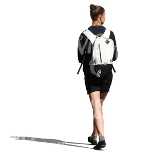 woman with a white backpack walking in the sunlight