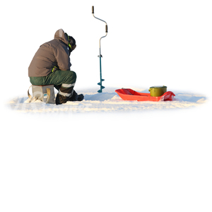 man ice fishing on a snowy lake