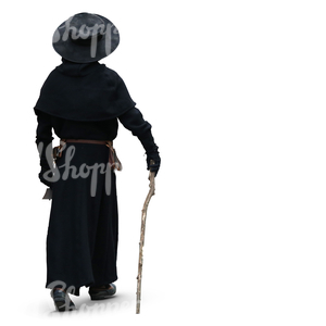 man in a black medieval costume walking