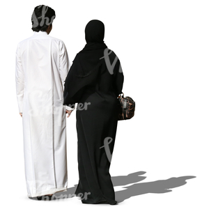 arab couple in traditional clothes walking hand in hand