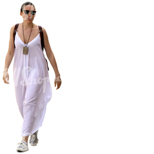 woman in a long white summer dress walking