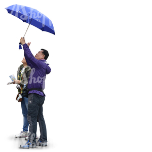 two asian people standing under an umbrella and looking up