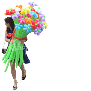 woman in a blue dress walking and carrying balloon flowers