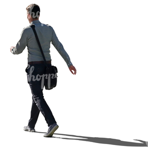 backlit man walking hastily