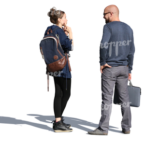 man and woman standing on the street and talking