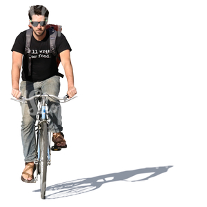 young man riding a bike in summertime