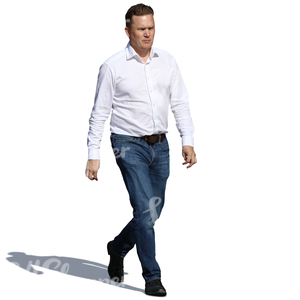 man in a white shirt and jeans walking in sunlight