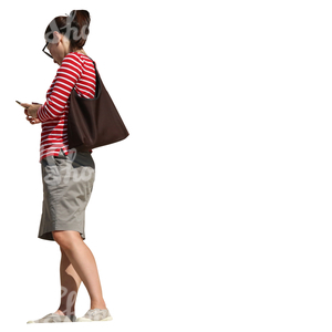 woman standing on a balcony and looking at her phone