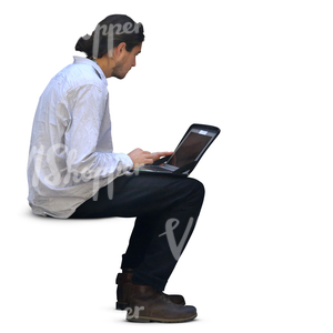 man sitting and working on his laptop