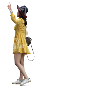 asian woman in a yellow summer dress standing