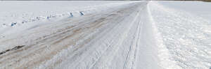 snowy road in sunlight