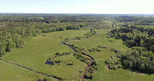 aerial photo of a small creek in countryside