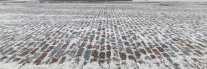 snowy historic pavement