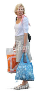 woman standing with two bags in her hands