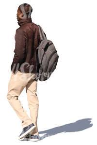 african man with a backpack walking