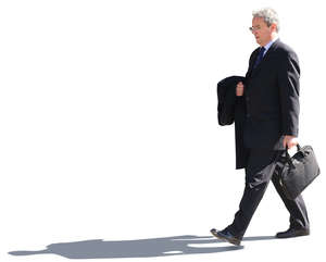 senior businessman walking on the street