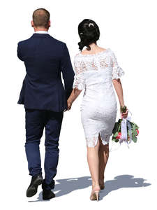 couple in formal clothes walking hand in hand