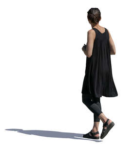 woman in a black summer dress walking