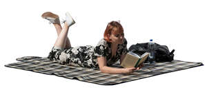 cut out young woman lying on the ground and reading a book