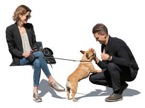 cut out man and woman sitting and petting  a small dog