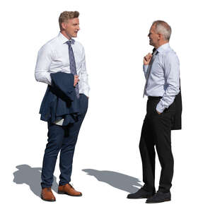 two businessmen standing in sunlight and talking