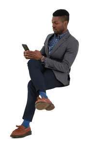 cut out man sitting and texting