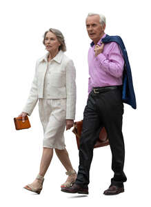 two older people in formal clothing walking