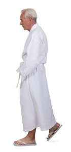 cut out grey haired man in a white bathrobe walking