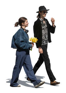 two cut out young people walking