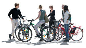 cut out backlit group of five people with bikes standing and talking