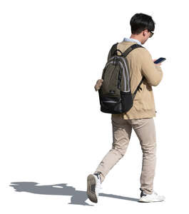 cut out asian man walking and checking his phone