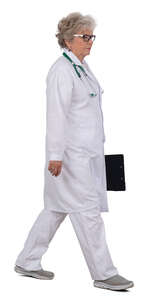 grey haired doctor walking