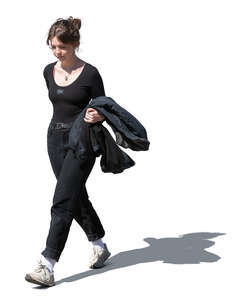 young woman in black clothing walking