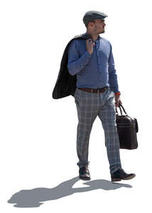 backlit man carrying a portfolio walking