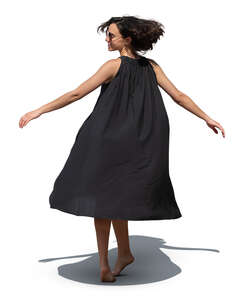 cut out woman in a black dress twirling