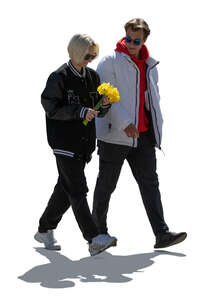 cut out backlit man and woman walking and holding flowers