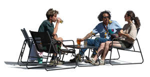 three cut out people sitting in a lounge cafe