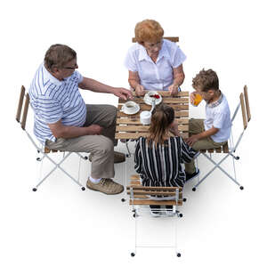 top view of grandparents sitting in a cafe with their grandkids