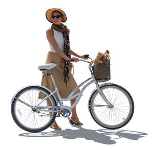 cut out backlit woman with a bike standing